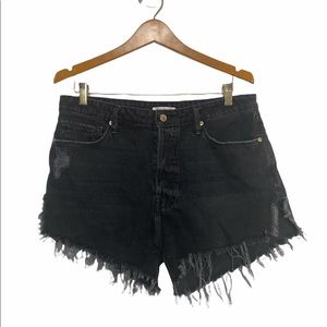 Good American bombshell black denim frayed shorts